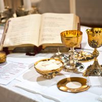 The wine and the bread become the blood and body of Christ