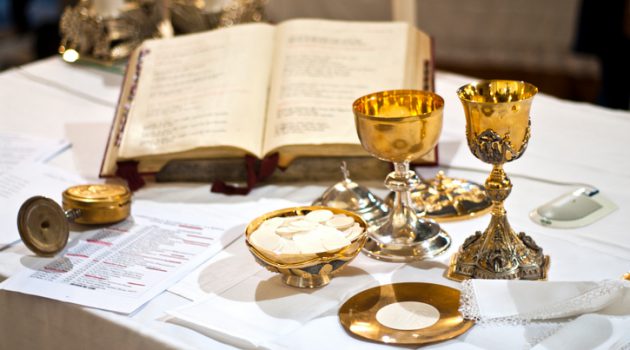 The wine and the bread become the blood and body of Christ